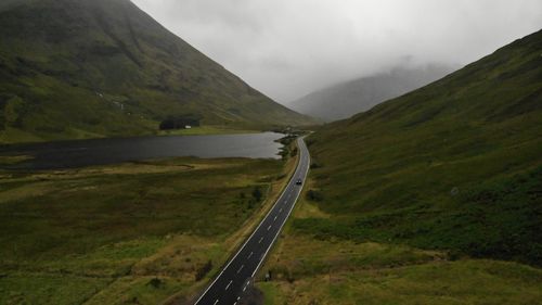 Panoramic view of road amidst landscape against sky