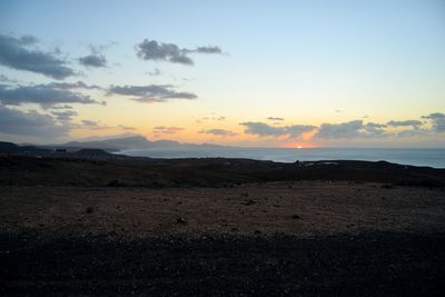 Scenic view of landscape against sky during sunset