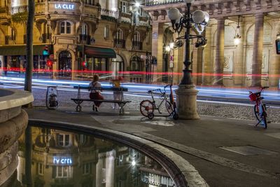 People on street in city at night