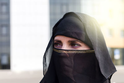 Close-up of woman wearing hat