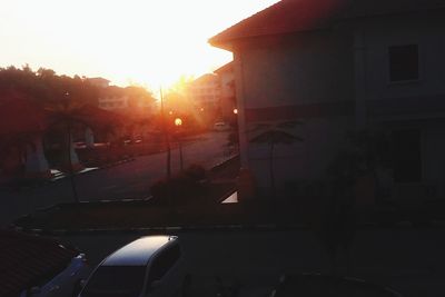 Sun shining through buildings