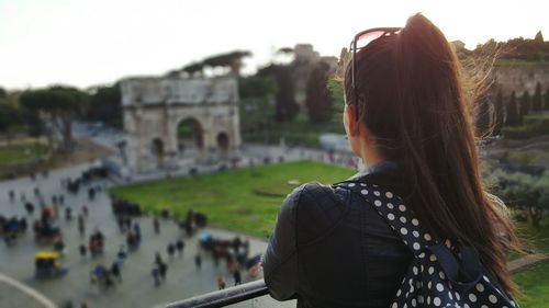 Woman looking at view of city