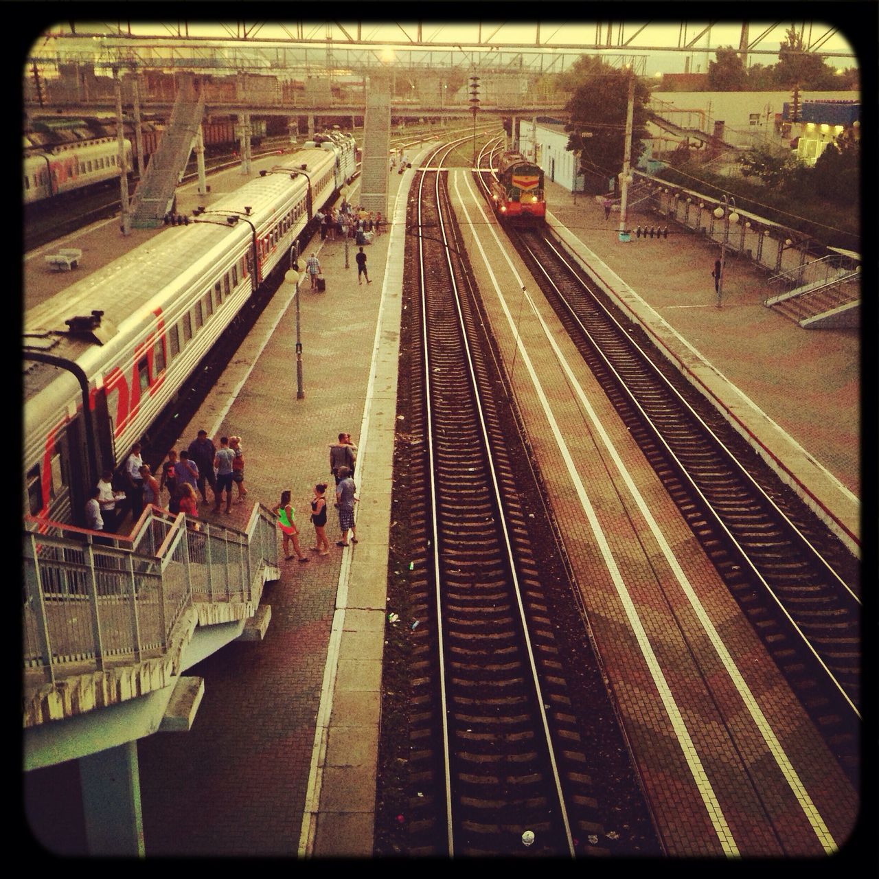 railroad track, transportation, rail transportation, public transportation, high angle view, railroad station, railroad station platform, transfer print, large group of people, the way forward, travel, diminishing perspective, auto post production filter, vanishing point, railway track, architecture, built structure, city life, person