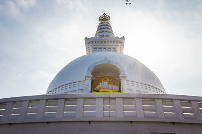 Buddhist stupa isolated with amazing blue sky from unique perspective