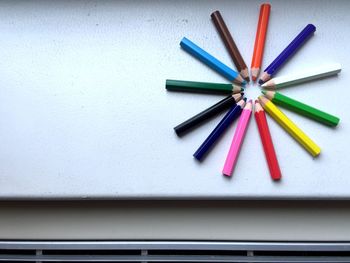 Directly above shot of colored pencils on table