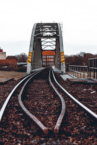 Surface level of railroad tracks against clear sky