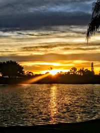Scenic view of sea against orange sky