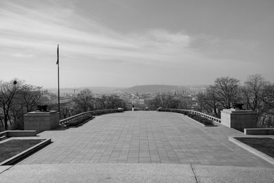 Empty street amidst buildings against sky
