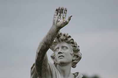 Low angle view of statue against sky