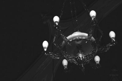 Low angle view of illuminated chandelier in amusement park