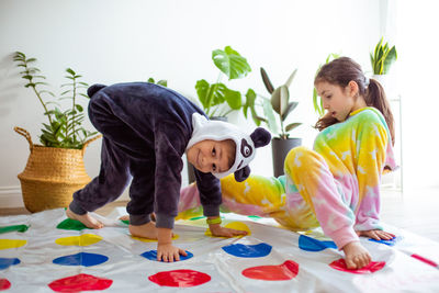 Full length of children playing at home