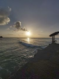 Scenic view of sea against sky during sunset