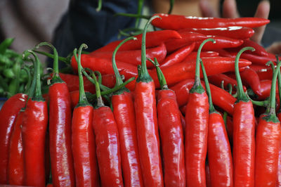 Close-up of red chili peppers for sale at market stall