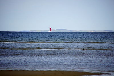 Scenic view of sea against clear sky