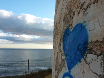 Sea shore against sky