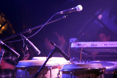 Microphones and drums at music concert