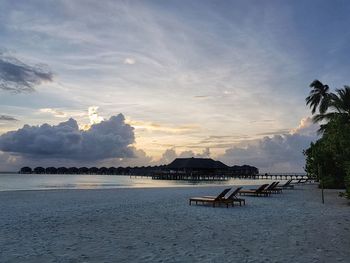 Scenic view of beach against sky during sunset