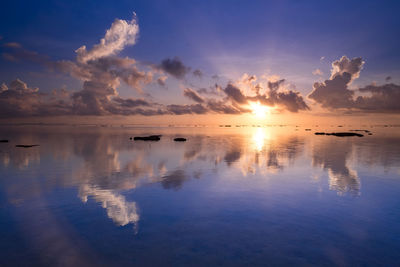 Scenic view of sea against sky at sunset