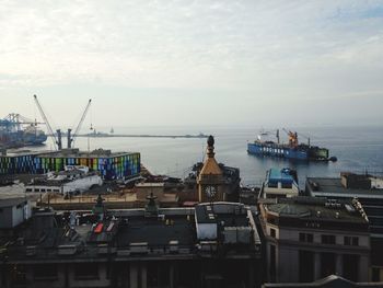 Boats moored at harbor