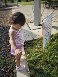 Full length of cute girl standing on field