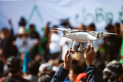 Man holding drone in event