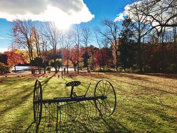 Bicycle on grass against sky