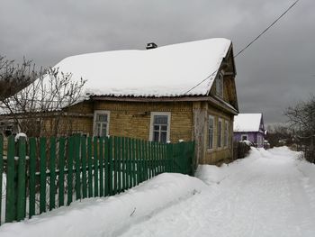 House on snow covered field