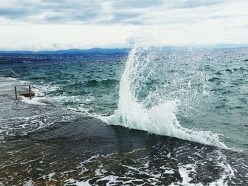 Scenic view of sea against cloudy sky