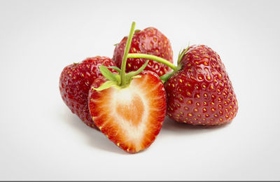 Close-up of strawberry over white background