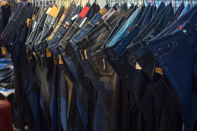 Panoramic shot of clothes hanging in row