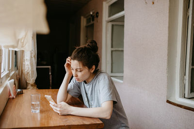 Side view of boy looking at home