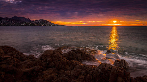 Scenic view of sea against sky during sunset