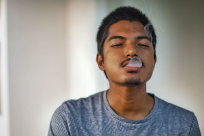 Portrait of young man looking away