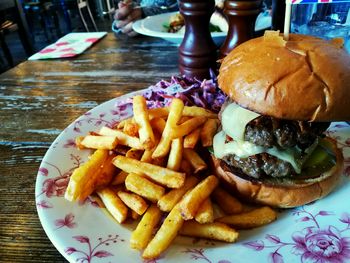 High angle view of meat and fries on plate