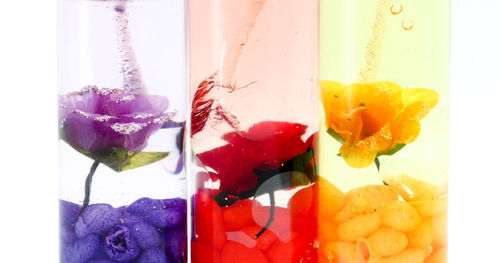 Close-up of multi colored candies against white background