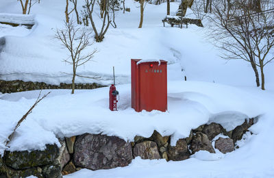 Red fire spot covered by snow, japan