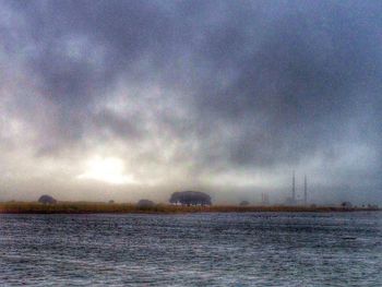 Scenic view of sea against cloudy sky