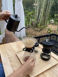 Cropped hands of man using mobile phone