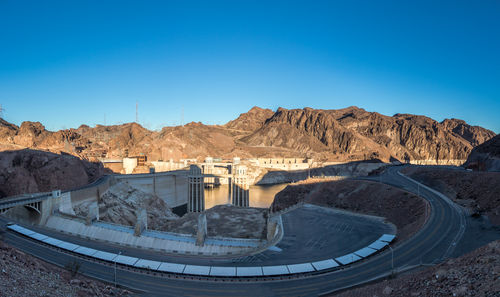 Scenic view of mountains against clear blue sky