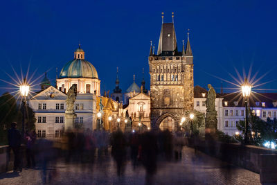 Illuminated buildings in city at night