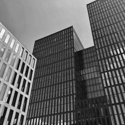 Low angle view of modern buildings against sky in city