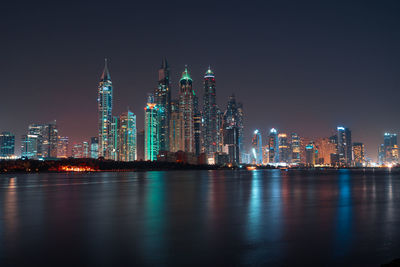 Illuminated buildings in city at night