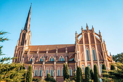 Low angle view of traditional building against clear blue sky