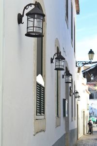 Street light by building in city