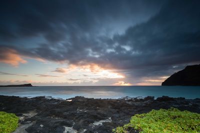 Scenic view of sea at sunset