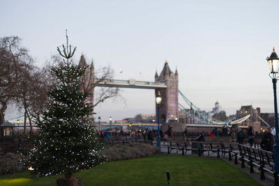 Bridge in city against clear sky