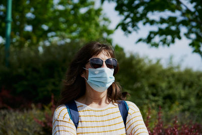 Woman in mask in park