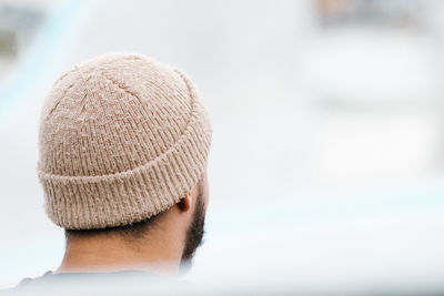 Rear view of man wearing knit hat