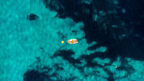 High angle view of boat floating on the sea