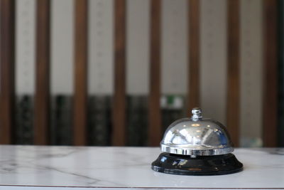 Close-up of electric lamp on table